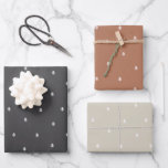 Rustic Minimalist Scandinavian Pine Trees Wrapping Paper Sheet<br><div class="desc">This minimalist Scandinavian style wrapping paper set features a trio of stylish designs, each featuring the same simple repeating white pine tree motif on muted backgrounds of charcoal black, terracotta brown, and beige grey. The understated elegance of the tiny tree pattern adds a touch of natural Nordic charm, perfect for...</div>