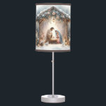 Rustic Nativity Scene with Winter Florals Table Lamp<br><div class="desc">This serene nativity scene captures the peaceful beauty of the Holy Family beneath a rustic wooden stable, gently lit by lanterns and surrounded by soft snowfall. The design features Mary, Joseph, and baby Jesus in a warm, reverent moment, accentuated by delicate winter florals, snow-covered pine branches, and glowing string lights....</div>