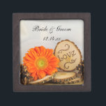 Rustic Orange Daisy Woodland Wedding Gift Box<br><div class="desc">Carry your rings down the aisle in a charming personalized Rustic Orange Daisy Woodland Wedding Gift Box. This custom outdoors woods or forest wedding trinket box features a quaint digitally enhanced nature photograph of an orange daisy flower blossom, natural wood slices with the word LOVE on it, brown pines cone...</div>