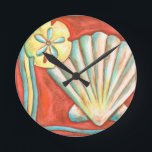 Rustic Orange Seashells Round Clock<br><div class="desc">Lay out on the warm sand and find the hidden treasures! This painting by Nancy Slocum captures the beautiful water life found ashore. It captures the a beautiful orange seashell, an orange starfish, and a vibrant blue sand dollar. Get your beautiful ocean art today on your next Zazzle product.</div>