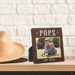 Rustic Personalized Pops Grandpa Photo Plaque<br><div class="desc">Custom grandpa plaque for Father's Day,  birthdays,  or Grandparents Day features a favourite photo of his grandchild or grandkids with "Pops" above in rustic lettering. Personalize with the year he became a grandfather beneath,  or add a custom message or name.</div>