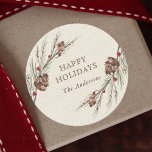 Rustic Pinecone Christmas Holiday Classic Round Sticker<br><div class="desc">Send holiday cheer to your family and friends. This design features watercolor pine corns and  red berries on a faux burlap canvas texture background. For more advanced customization of this design,  Please click the "Customize" button. Matching items are also available.</div>