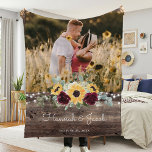 Rustic Sunflower Wedding Couple Photo Fleece Blanket<br><div class="desc">This rustic sunflower and burgundy roses country wedding couple photo blanket makes a perfect gift. This blanket features watercolor yellow sunflowers with burgundy roses and baby's breath and sage greenery on a wood background. This is a perfect colour scheme for a late summer or fall wedding. Personalize with names and...</div>