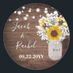Rustic Sunflowers String Lights Monogram Wedding Classic Round Sticker<br><div class="desc">This wedding sticker design features pretty painted sunflowers and string lights on a rustic dark wood background. Click the customize button for more flexibility in modifying the text. Variations of this design, different paper types, as well as coordinating products are available in our shop, zazzle.com/store/doodlelulu. Contact us if you need...</div>