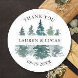 Rustic Trees Forest Woodland Thank You Wedding Classic Round Sticker<br><div class="desc">Elegant watercolor pine forest trees (woodland / mountain) in deep green colours.  Perfect stickers / labels for a rustic winter wedding.  Perfect for envelopes,  favours,  gifts,  etc... Easy editable template - just add text.  Option to change colour & size.  See the 'LAUREN' collection for matching items.</div>