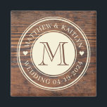 Rustic Wedding Heart Monogram in Dark Walnut Magnet<br><div class="desc">Elevate your rustic wedding décor with the Rustic Wedding Heart Monogram in Dark Walnut Magnet. This charming magnet features a heart monogram design set against a rich dark walnut background, adding a personalized touch to any magnetic surface. Whether used to secure important notes or to adorn your refrigerator with sentimental...</div>