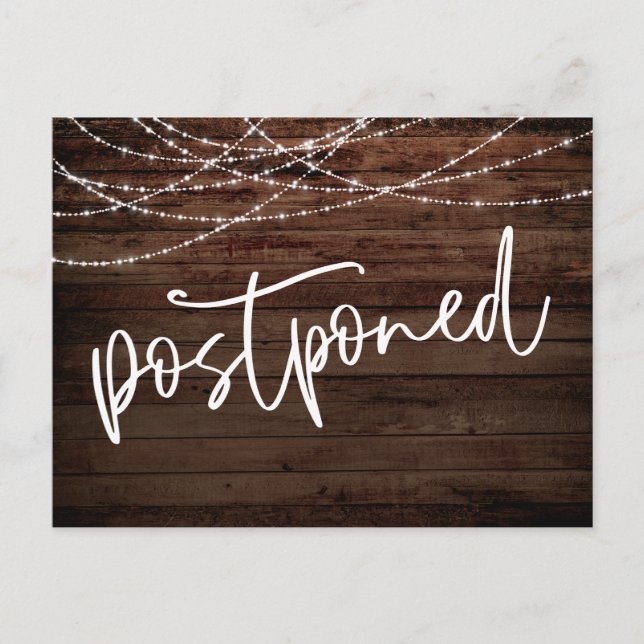 Rustic Wood and Light Strings Postponed Wedding Postcard (Front)