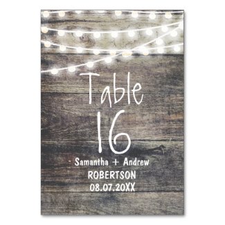 Rustic wood and string lights table number