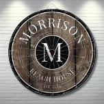 Rustic Wood Family Name  Dartboard<br><div class="desc">This rustic dartboard is the perfect addition to your family beach house, lake house, game room, man cave, and more. It features a bold initial monogram at the centre, with your family name proudly displayed at the top. The bottom reads "Beach House, " but this can be customized to fit...</div>