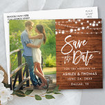 Rustic Wood Lights Brush Script Save The Date Postcard<br><div class="desc">Modern Brush Script,  Rustic Wood,  String Lights Save The Date Engagement Couple Photo Postcard</div>