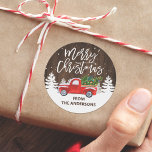 Rustic Wood Merry Christmas Truck Pine Trees Classic Round Sticker<br><div class="desc">This design beautifully combines the charm of a vintage truck with the serenity of pine trees,  creating a perfect symbol of the Christmas spirit. Ideal for labelling your holiday gifts,  sealing envelopes,  or decorating your Christmas cards.</div>