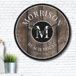 Rustic Wood Monogram Family Name Large Clock<br><div class="desc">This rustic clock is the perfect addition to your family beach house, lake house, game room, man cave, and more. It features a bold initial monogram at the centre, with your family name elegantly displayed at the top. The bottom reads "Beach House, " but this can be customized to fit...</div>