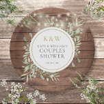 Rustic Wood Monogram Greenery Couples Shower Paper Plate<br><div class="desc">Featuring pretty string lights and delicate watercolor greenery leaves on a rustic wood background,  these chic botanical couples shower paper plates can be personalized with your monogram initials and special couples shower details. Designed by Thisisnotme</div>