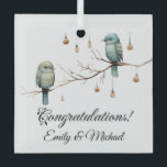 Rustic Woodland Love Birds  Romantic Wedding  Glass Ornament<br><div class="desc">This charming image features two delicate birds perched on a bare branch, surrounded by hanging glass lights that look like vintage lanterns. The soft hues of green and blue in the birds' feathers and the minimalist background give the design a whimsical and rustic feel. The lights add a warm, magical...</div>