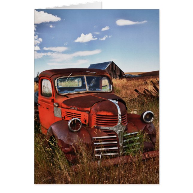 Rusting orange Dodge truck with abandoned farm (Front)