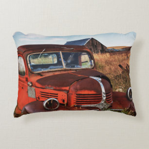 Rusting orange Dodge truck with abandoned farm Accent Pillow