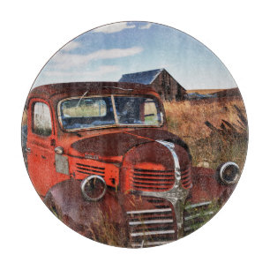 Rusting orange Dodge truck with abandoned farm Cutting Board