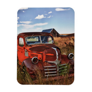 Rusting orange Dodge truck with abandoned farm Magnet