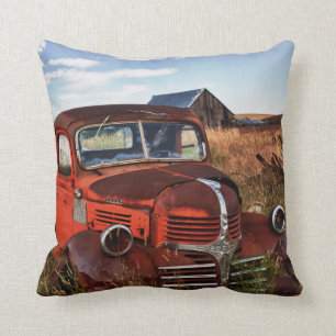 Rusting orange Dodge truck with abandoned farm Throw Pillow