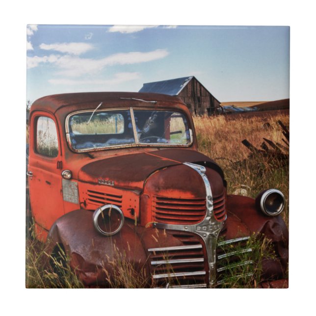 Rusting orange Dodge truck with abandoned farm Tile (Front)