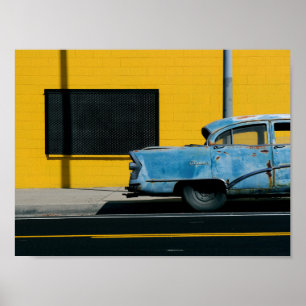 Rusty Blue Car and Yellow Wall Poster
