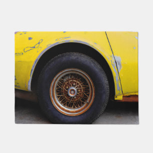 Rusty Roadmaster Tire, Peeling Yellow Painted Car Doormat
