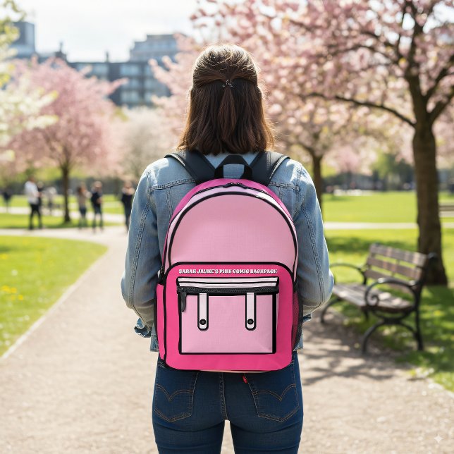 Sac à dos imprimé de style BD rose (A fun cartoon comic style backpack with space for your name)