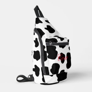 Sac à roulettes à taches de vache noires et blanch