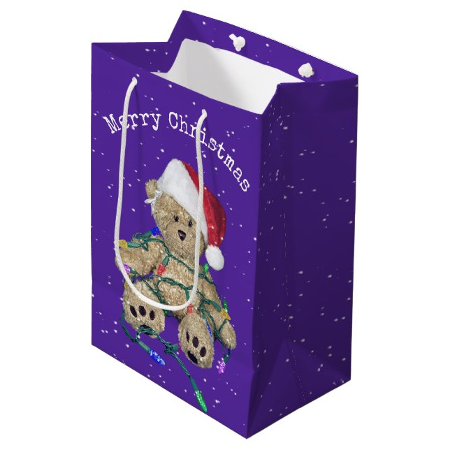 Sac Cadeau Moyen Ours En Teddy De Noël Aux Lumières Tangées (Devant Angle)