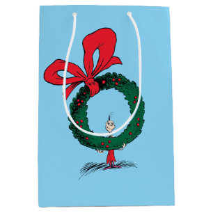 Sac Cadeau Moyen Qui regarde à travers la couronne de Noël
