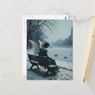 Sad angel sitting on a park bench postcard
