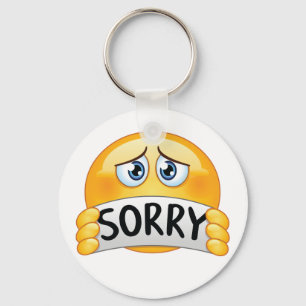 Sad Sorry Emoji Face Holding Apology Sign Keychain