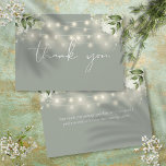 Sage Green Floral Greenery String Lights Thank You Card<br><div class="desc">Featuring delicate floral greenery, pretty string lights and an elegant thank-you script on a sage green background. You can personalize with your own thank you message on the reverse, or if you prefer to add your handwritten message, delete the text. A perfect way to say thank you! Designed by Thisisnotme©...</div>