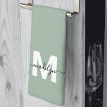 Sage Green Name Monogram Kitchen Towel<br><div class="desc">Custom Sage Green Monogram Name Kitchen Towel. Add a stylish personal touch to your kitchen with this elegant towel design. The background is a soft sage green, paired with crisp white lettering for the initial and a bold black name in flowing script across the front. Designed for a tri-fold display,...</div>