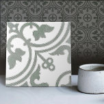 Sage Green Repro Backsplash Kitchen Portugese Tile<br><div class="desc">Set of 2 (1/2) This ceramic tile is a crossover from the Dutch Delft Blue tradition and Azulejo tiles in sage green and is a stunning example of artistry and craftsmanship. The tile features a symmetrical floral theme, with a central flower surrounded by smaller leaves. The tile is glazed in...</div>