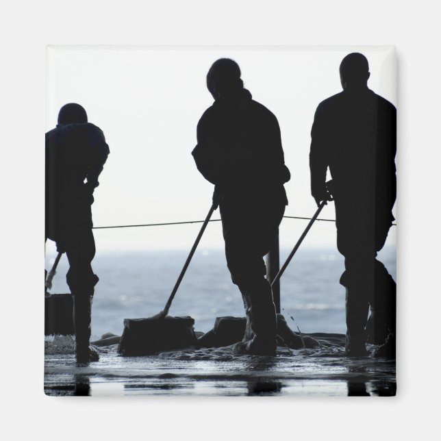 Sailors sweep out the hangar bay magnet (Front)