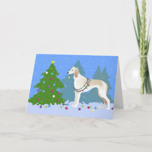 Saluki decorating a Christmas tree in the forest Holiday Card