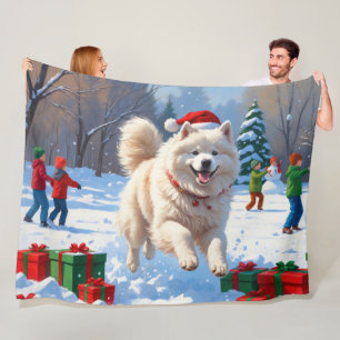 Samoyed Running in Snow with Christmas Hat Fleece Blanket