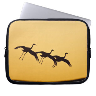 Sandhill Crane landing at sunset Laptop Sleeve