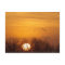 Sandhill cranes silhouetted aginst rising sun