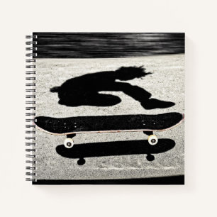 sandwiched skateboard notebook