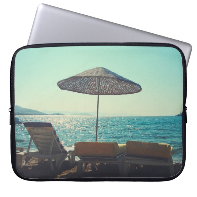 Sandy beach on a sunny afternoon,  with parasols a laptop sleeve (Front)