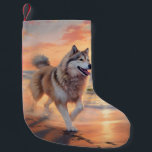 Sandy Paws Alaskan Malamute Dog on Beach Sunset Small Christmas Stocking<br><div class="desc">Immerse yourself in the tranquil beauty of our "Sandy Paws and Sunset Hues" dog on beach sunset design. This captivating scene captures the essence of a perfect evening at the shore, with a loyal canine companion enjoying the golden sands and the breathtaking hues of the setting sun. Whether you're a...</div>