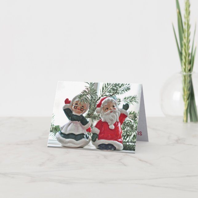 Santa and Mrs. Claus, figurines, pine boughs, Holiday Card (Front)