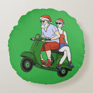Santa and Mrs. Claus riding a scooter Round Pillow