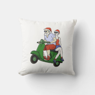 Santa and Mrs. Claus riding a scooter Throw Pillow