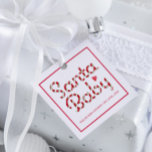 Santa Baby Red Baby Shower Favour Tag<br><div class="desc">Add a festive flourish to your holiday baby shower favours with this charming “Santa Baby” tag, featuring candy cane-striped lettering and a sweet red heart. Perfect for tying onto treat bags, party gifts, or keepsakes, this square tag brings playful Christmas cheer to your celebration. Customize with baby’s name and shower...</div>
