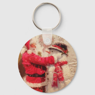 Santa claus and snowman in snowfall keychain