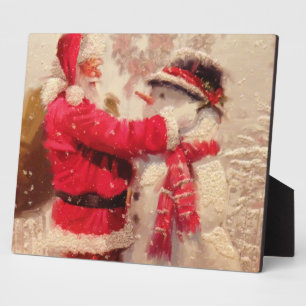 Santa claus and snowman in snowfall plaque