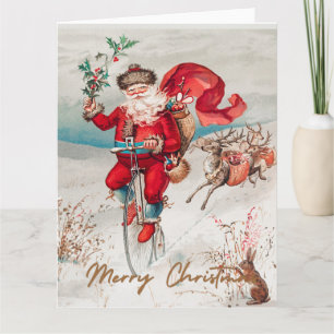 Santa Claus on a penny farthing with reindeer Card